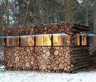 Modern Log Cabin Hidden in a Stack of Wood