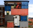 Shipping Containers and Cars Stacked High as Colorful Eco Sculptures!
