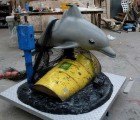 Banksy’s Coin-Operated, Politically Charged Dolphin Ride Mocks BP