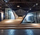 Renovated Warehouse Wrapped in a Flowing Cinderblock Skin