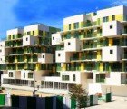 KOZ Completes 28 Green (Literally) and Yellow Stacked Apartments