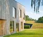 Modern Green-Roofed Homes Blend Into Poland’s Countryside