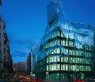 Origami-Like Glass Building Has a Striking Folded Facade