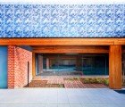 Green Dream Home Veiled by Intricate Filigree Leaf Facade
