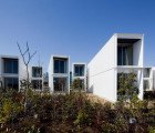 Elegant Japanese Cottages Stacked and Staggered Like Shipping Containers