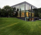 Preserved Cannon Foundry Wrapped in a Glass Box Makes for a Striking Modern House