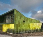 Lime Green Garbage Collection Center is a Recycled Aluminum “Urban Stomach”