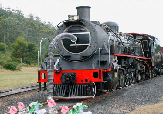 Train Recycled into Trash Sucking Machine recycled materials, old rail engine, old train, recycled train, indian rail, repurposed materials, trash sucking machine, green design, upcycling, garbage inhaling machine