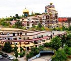 Waldspirale is a Curvy Rainbow Colored Apartment with a Forest on Top