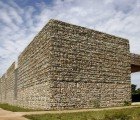 Striking Villanueva Library Has Walls Lined with Natural River Rocks