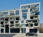 Gleaming White, Cubic Apartment Building Helps Redevelop HafenCity In Hamburg