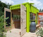 Bright Green Shipping Container Hut Welcomes Visitors to Evergreen Brickworks In Toronto