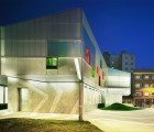 CrystalZoo’s Renovated School is Wrapped in a Silver Membrane with Pops of Vibrant Color