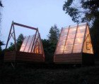 Sustainably Built Swamp Huts Light Up Like Glowing Lanterns in the Forest