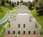 Space Invaders: NL Architects Unveils Green-Roofed Apartments That Resemble the Classic Video Game