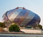 Spherical iGuzzini Headquarters Shaded by a Massive Prismatic Fabric Screen