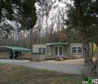 Redneck Shipping Container House Comes Complete With Solar Panels & Camo Decor