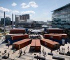 A Cacophony of Shipping Containers Jazzes Up This “Music Box” Installation in Manchester
