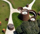 Lugo’s Weathered-Steel History Museum Keeps Cool Inside Subterranean Cylinders
