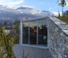 Underground Swiss Mountain Retreat Peeks Out From the Terraced Stone Hillside