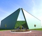 Trapezoid-Shaped Eye Bank Building Hugs a Slope of Stepped Green Terraces