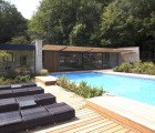 Roundles: Modern Pool House Made of Local Limestone is a Peaceful Addition to a Country Cottage