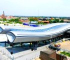 Shiny, Tubular Slough Bus Station Improves Pedestrian Access