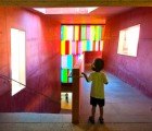 Candy-Colored Glass Illuminates a Passageway Between Renovated 16th Century Buildings in Portugal