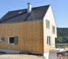 Solar-Powered Black Forest Wooden House K is Built Around a Core of Clay