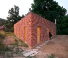 H Arquitectes’ Triangular House 712 Takes Shape with Perforated Bricks