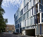 CHL Social Housing is Clad With Bright Blue Louvers for Sun Protection & Privacy
