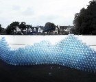 Waving Wall: Massive Recycled Bottle Installation Shows the Virtual Water Footprint of Two Pairs of Jeans