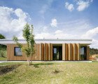 OV-A’s Family House in Králuv Dvur Features a Folding Wood Shutter Facade