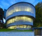 Cocoon is a Spiraling Mesh-Encased Office Nestled Into a Park in Zurich