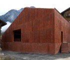 Atelier Bardill is a Striking Rust-Colored Barn Renovation in Switzerland