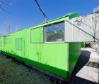 Escuela Santa Matilde is a Fluorescent Green Prefab School for Children in Chile