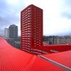 Bright-Red U-Shaped Salburua Social Housing Sells Excess Energy in Spain