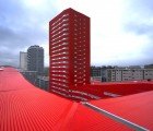 Bright-Red U-Shaped Salburua Social Housing Sells Excess Energy in Spain
