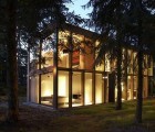 Berlin’s Passive Minimum House is a Modernist Glass Residence in the Woods