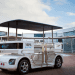 Induct, Navia, electric shuttle, electric vehicle, driverless vehicle, wireless charging. autonomous vehicle, pedestrians, urban areas, transportation, mobility