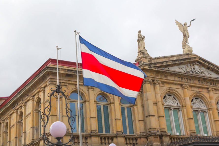 Flag of Costa Rica in front of the San Jose National Theater