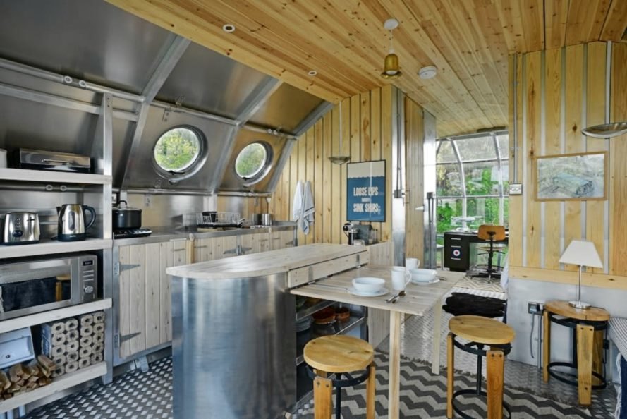 an aluminum kitchen with wooden paneling