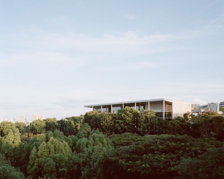SDE4 sits atop a hill of greenery surrounded by trees