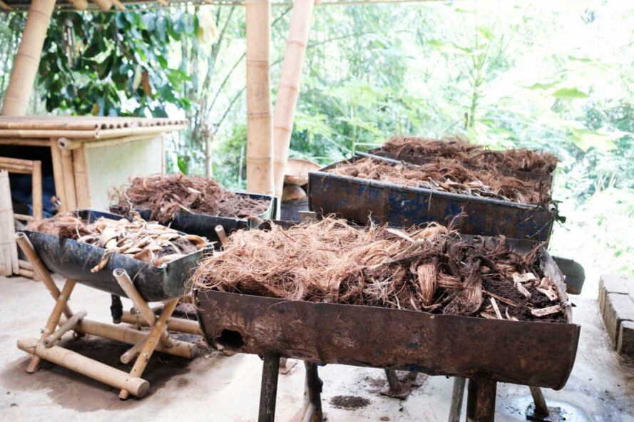 large containers filled with compost materials