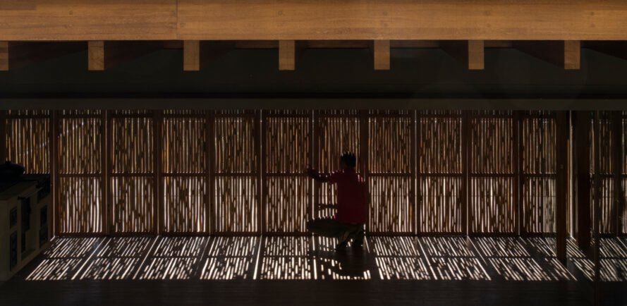 an elongated shade made out of eucalyptus branches