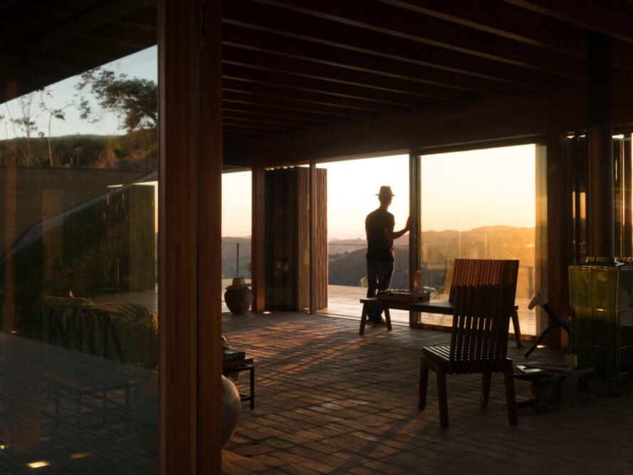 man looking out of wooden deck