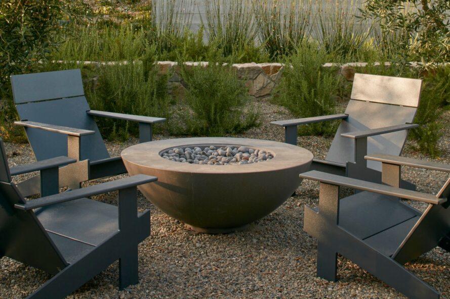 firepit surrounded by four chairs