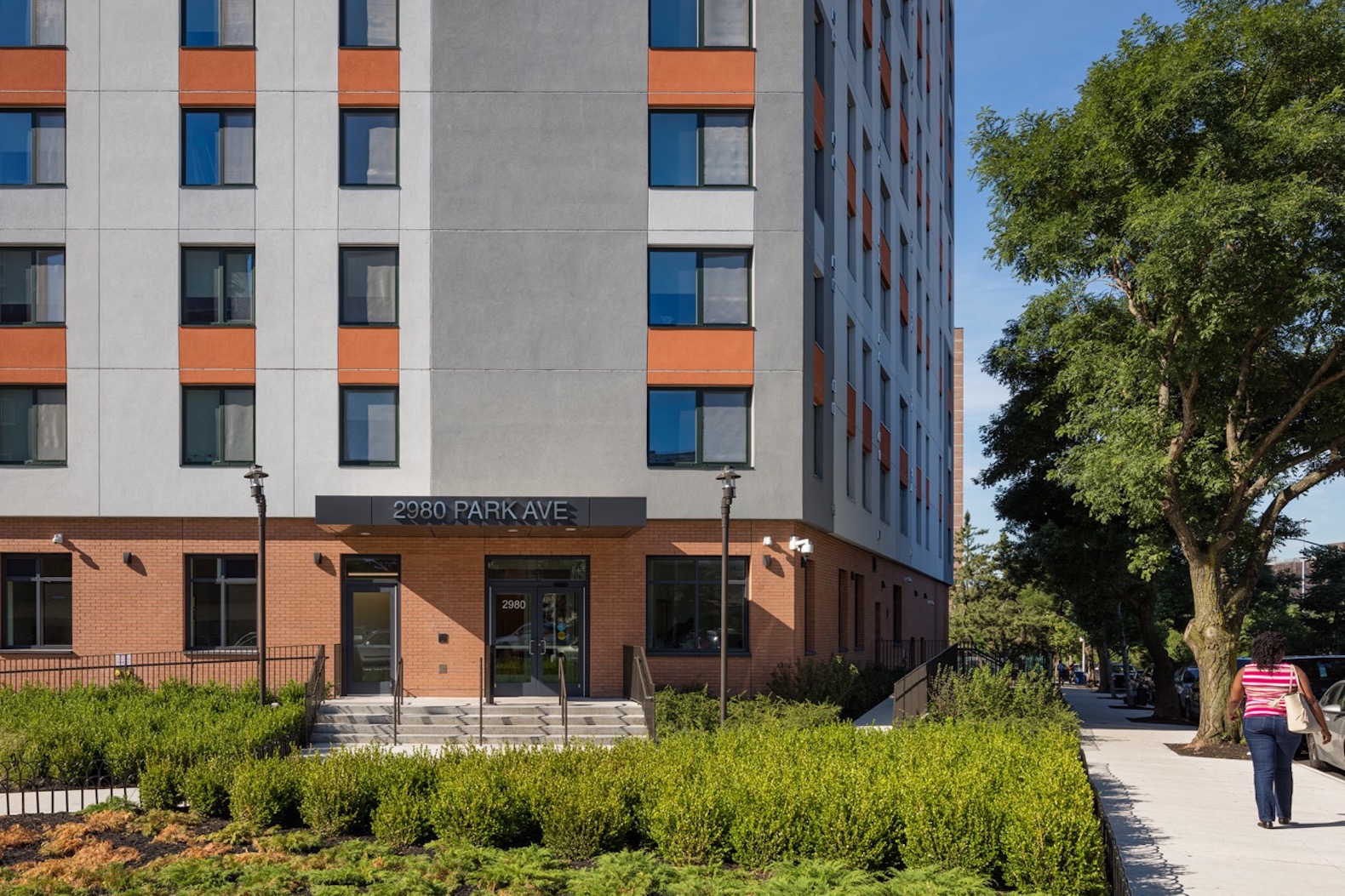 ground floor entrance to a large gray and orange building