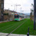 trams on grass, sustainable transportation, european public transportation, green transportation, urban design, urban heat island effect, green design, grass lined public transportation tracks