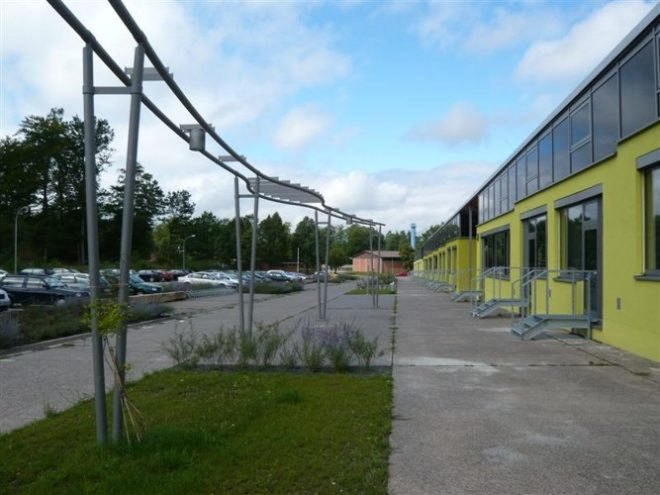 German green school, HHS Architecken, thin film solar roof, solar translucent roof, solar windows, repurposed school, reused building, solar powered school, natural ventalation